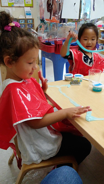 children playing with silly putty